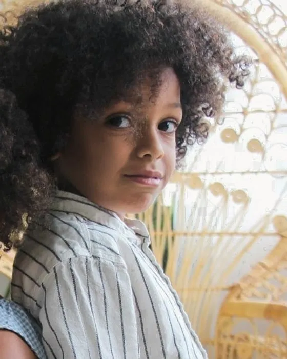 Little boy with big, voluminous curls